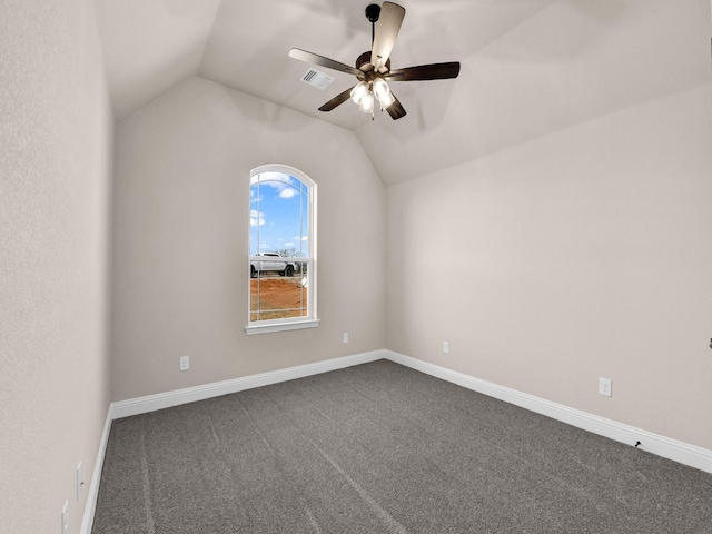 carpeted empty room with lofted ceiling and ceiling fan