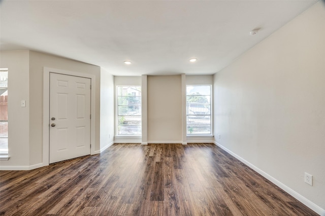 foyer entrance with dark hardwood / wood-style flooring