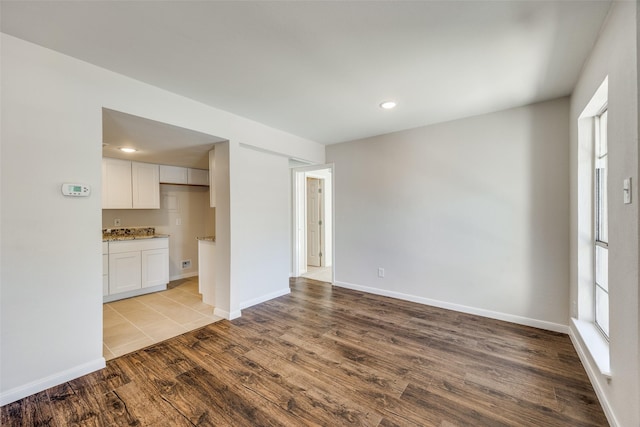 unfurnished living room with light hardwood / wood-style floors