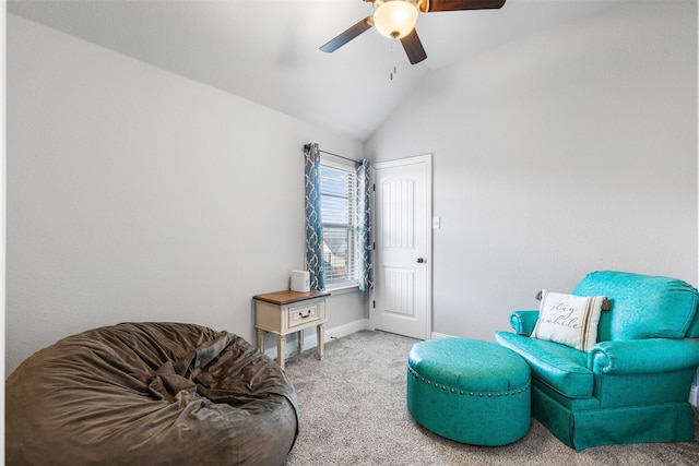 living area with ceiling fan, vaulted ceiling, and carpet floors