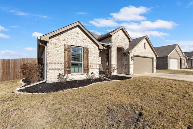 view of front of home featuring a garage and a front yard