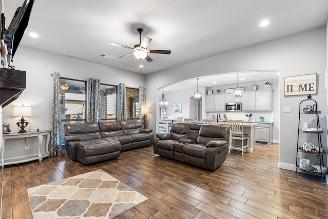 living room featuring ceiling fan