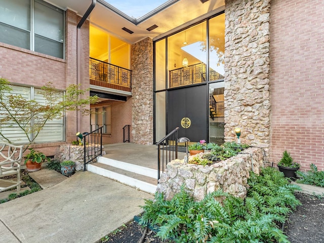 doorway to property featuring a balcony