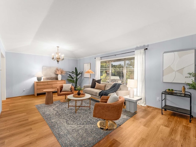 living room with an inviting chandelier and light wood-type flooring