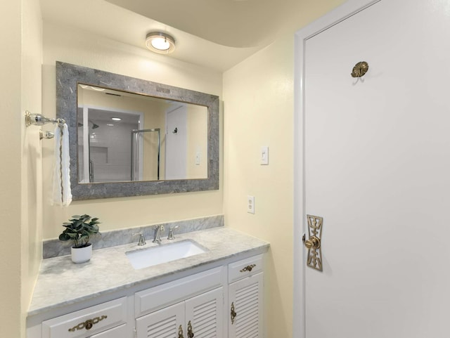 bathroom featuring vanity and walk in shower