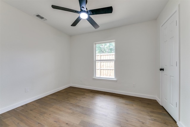 unfurnished room with light wood-type flooring and ceiling fan