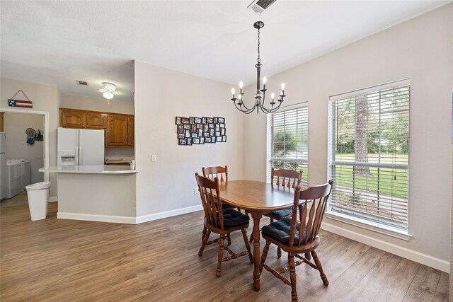 living room with a textured ceiling, hardwood / wood-style floors, and ceiling fan