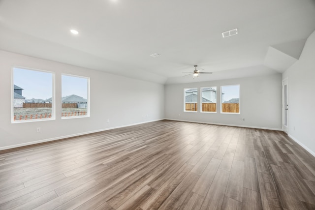 unfurnished room with ceiling fan and light wood-type flooring