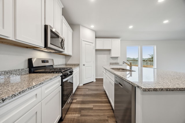 kitchen featuring white cabinetry, sink, and stainless steel appliances