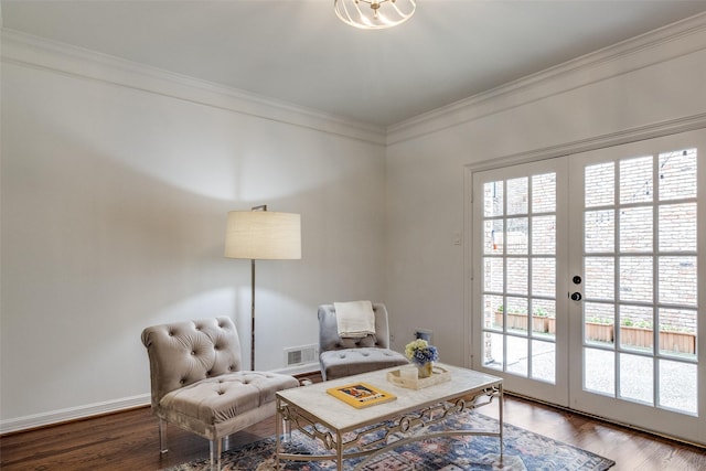 living area with ornamental molding, french doors, and wood-type flooring