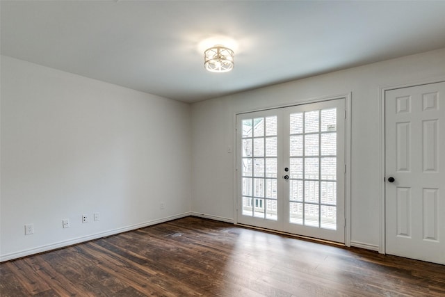 empty room with dark wood-type flooring