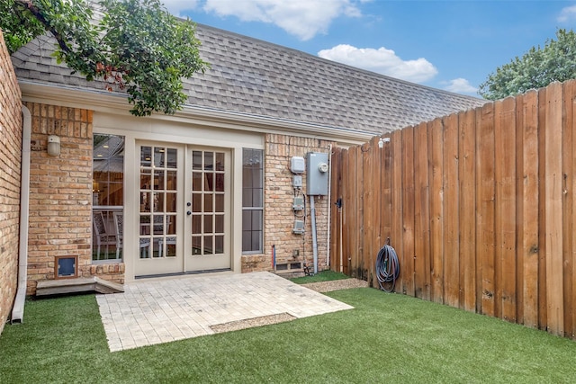 view of outbuilding with french doors and a yard