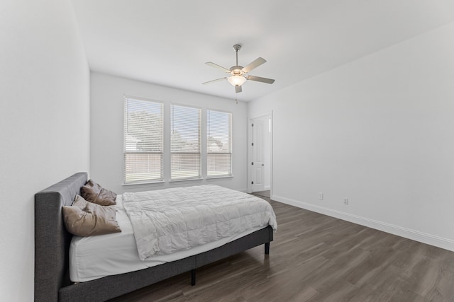 bedroom featuring ceiling fan and dark hardwood / wood-style floors