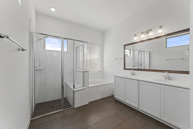 bathroom with vanity and independent shower and bath