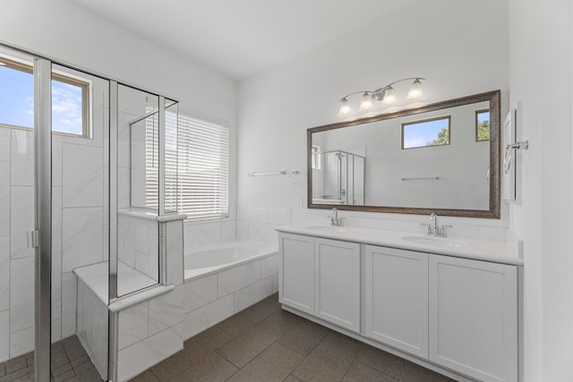 bathroom featuring independent shower and bath and vanity