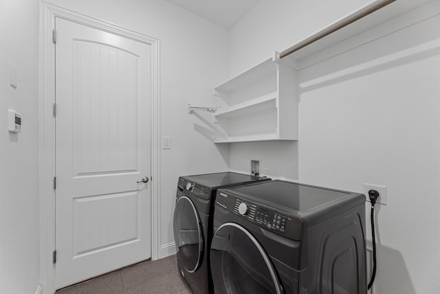 laundry area with independent washer and dryer