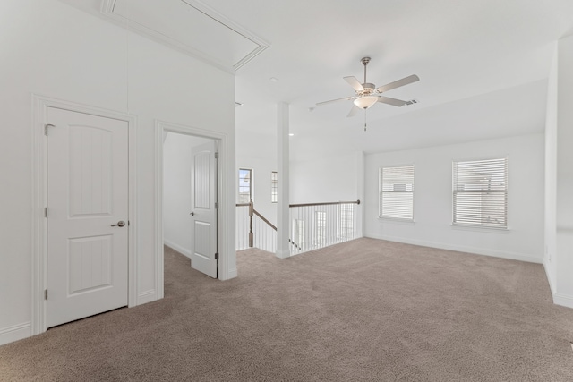 unfurnished living room featuring ceiling fan and carpet