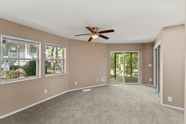 unfurnished room with light carpet and ceiling fan