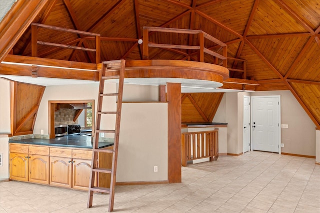 kitchen featuring lofted ceiling, wooden ceiling, and light tile patterned floors