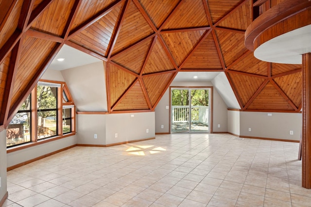 additional living space featuring light tile patterned floors and wood ceiling