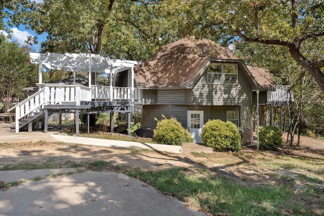 view of front of house with a deck and a pergola