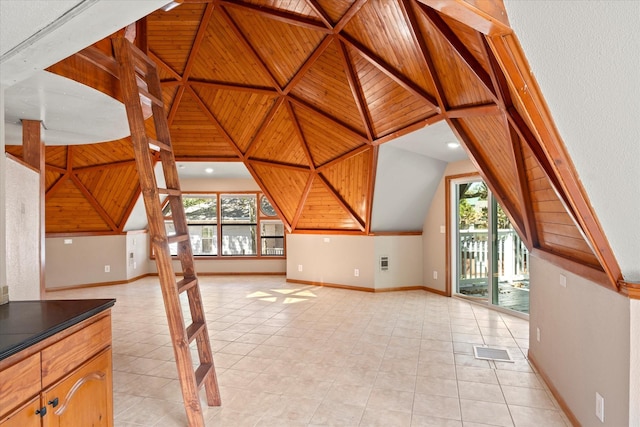 bonus room with wooden ceiling, a wealth of natural light, and light tile patterned floors