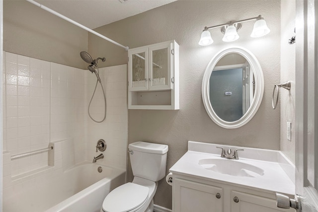 full bathroom with toilet, vanity, and  shower combination