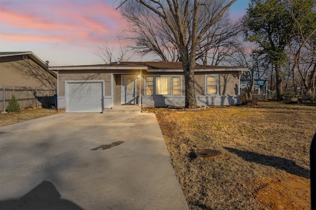 ranch-style home with a garage