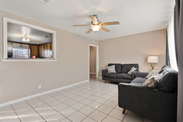 tiled living room featuring ceiling fan