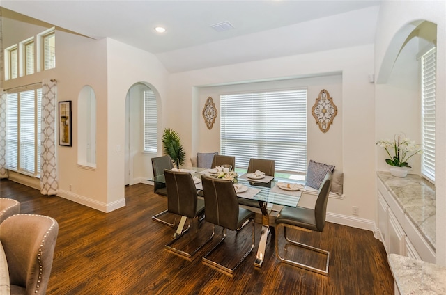 dining area with dark hardwood / wood-style flooring and plenty of natural light