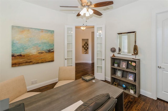 dining space featuring ceiling fan and dark wood-type flooring