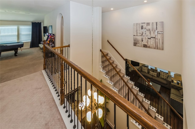 hallway with light carpet