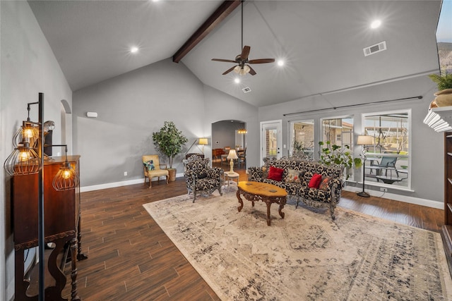 living room featuring ceiling fan, vaulted ceiling with beams, and dark wood-type flooring