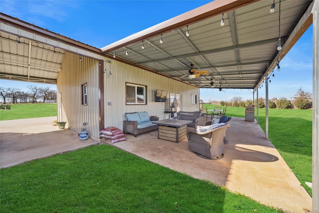 view of patio with ceiling fan and outdoor lounge area