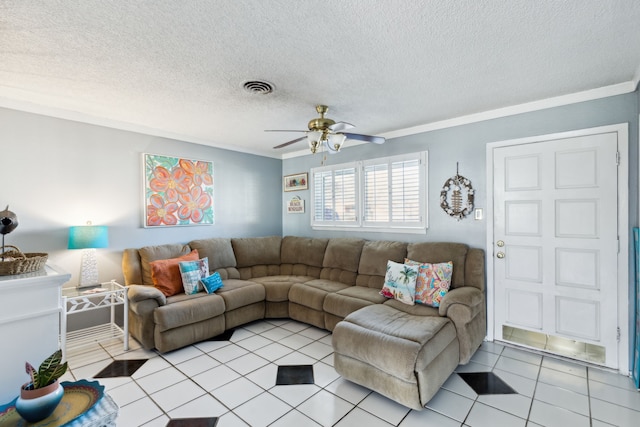 tiled living room with a textured ceiling, ornamental molding, and ceiling fan