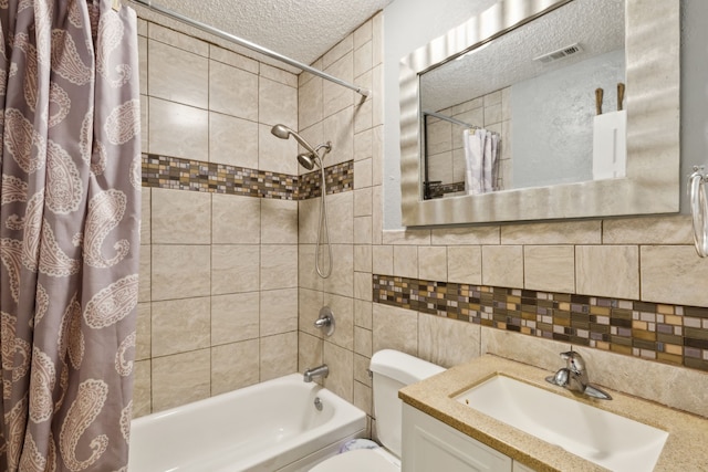 full bathroom featuring toilet, a textured ceiling, tasteful backsplash, shower / tub combo, and vanity