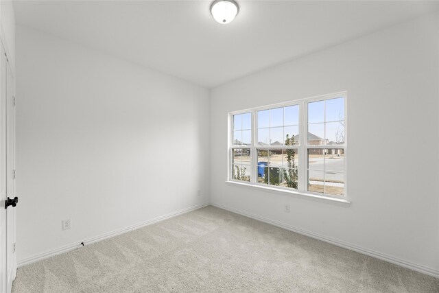 unfurnished bedroom featuring light colored carpet