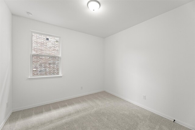 unfurnished room with carpet floors and plenty of natural light