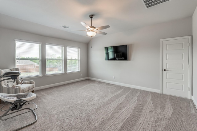 unfurnished room featuring ceiling fan and light colored carpet