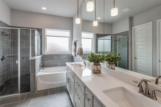 bathroom featuring tile patterned floors, separate shower and tub, and vanity