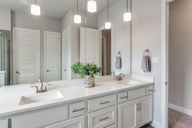 bathroom featuring an enclosed shower and vanity