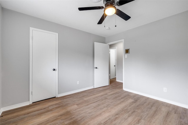 unfurnished bedroom featuring ceiling fan and light hardwood / wood-style floors