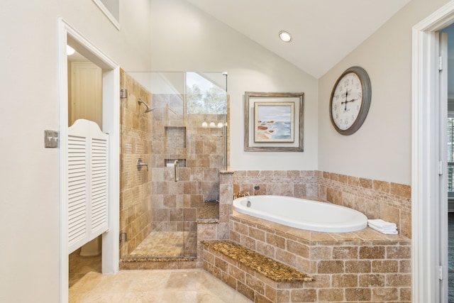 bathroom with separate shower and tub and vaulted ceiling