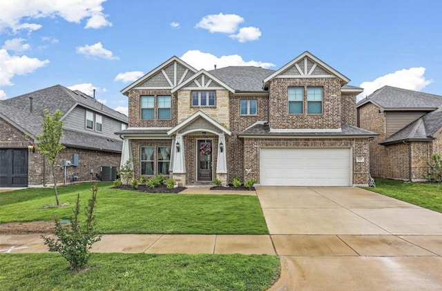 craftsman house featuring cooling unit, a front lawn, and a garage