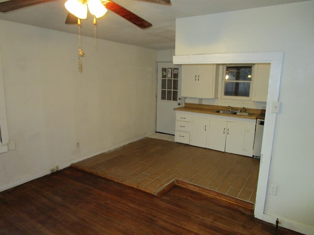 kitchen with white cabinets, ceiling fan, dishwasher, and sink