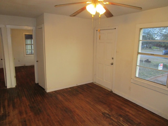 unfurnished room featuring ceiling fan and dark hardwood / wood-style floors