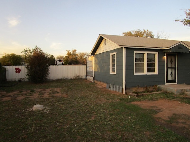 view of property exterior at dusk