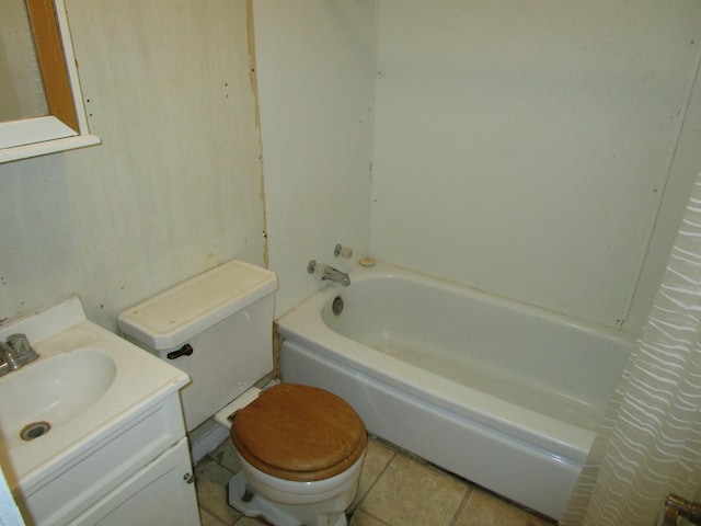 bathroom with toilet, tile patterned flooring, and vanity