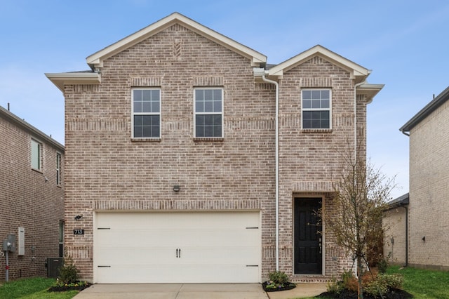 front of property featuring a garage and cooling unit