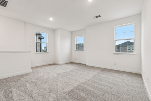 empty room with light colored carpet